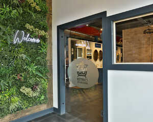 Frosted glass door with the logo "Distinct Bathrooms" and an image of a bathroom fixture.